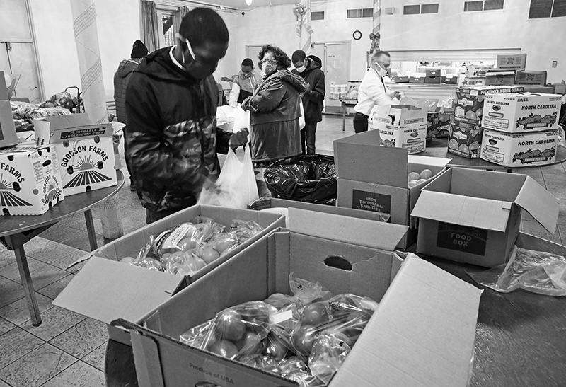2020 : Food Lines : Seventh Day Adventists Help the Needy : Streetlife : New York City : Times Square : Richard Moore : Photographer : Photojournalist